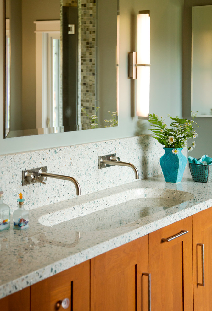 Inspiration for a large contemporary master bathroom remodel in Jacksonville with recessed-panel cabinets, medium tone wood cabinets, green walls, an integrated sink, terrazzo countertops and multicolored countertops