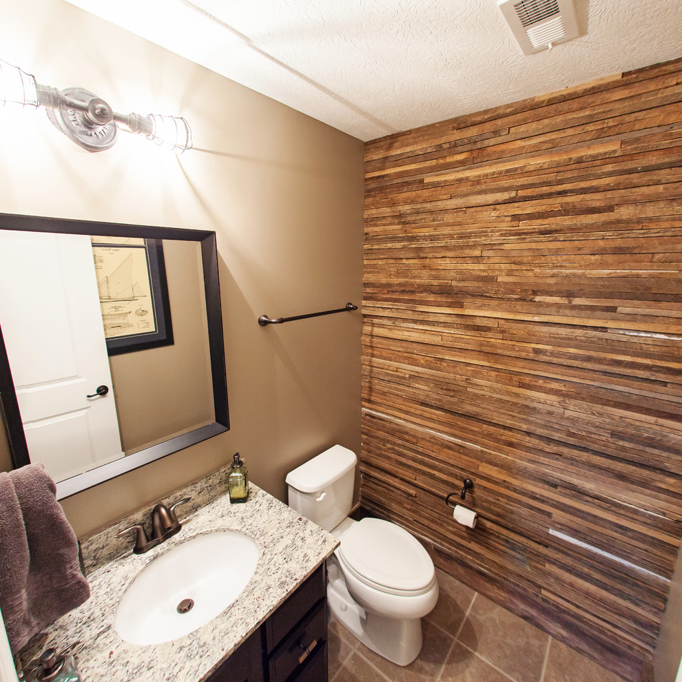 Inspiration for a small rustic 3/4 ceramic tile and brown floor bathroom remodel in Columbus with flat-panel cabinets, black cabinets, a two-piece toilet, brown walls, an undermount sink and granite countertops