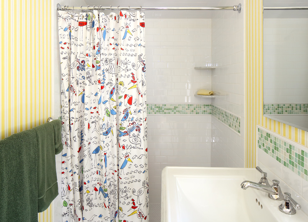 Photo of a medium sized eclectic family bathroom in New York with an alcove shower, a two-piece toilet, white tiles, ceramic tiles, yellow walls, ceramic flooring and a pedestal sink.