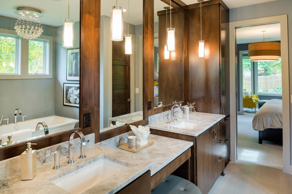 Example of a mid-sized trendy master white tile and ceramic tile ceramic tile bathroom design in Minneapolis with flat-panel cabinets, dark wood cabinets, a two-piece toilet, gray walls, marble countertops and an undermount sink
