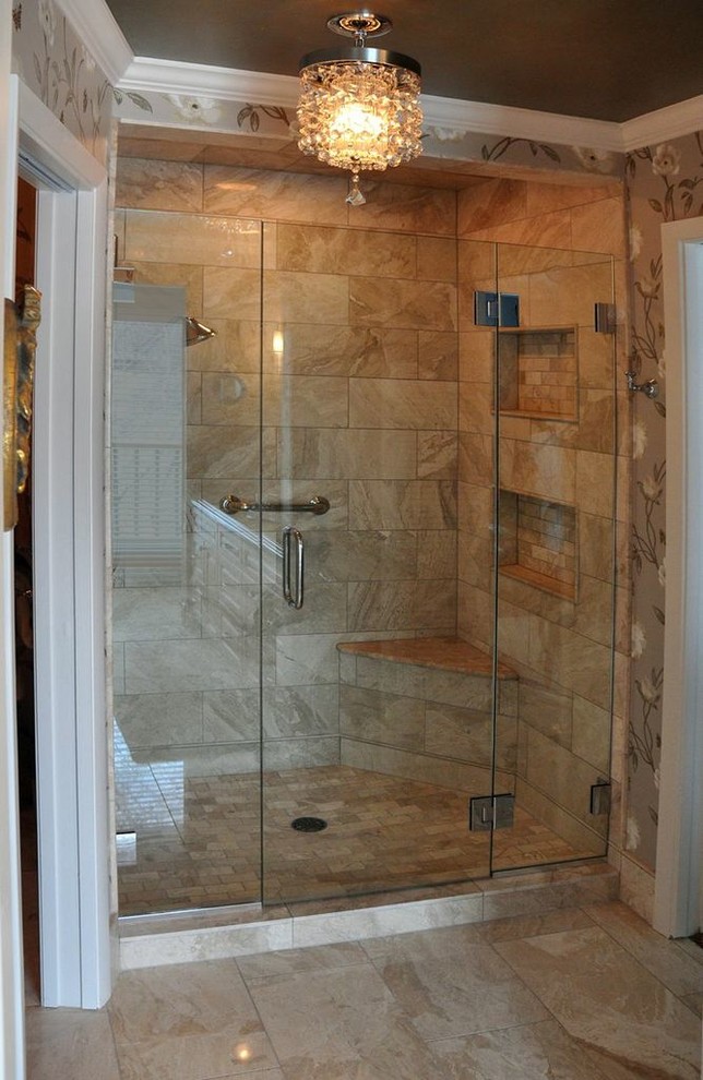 Inspiration for a medium sized traditional ensuite bathroom in Minneapolis with a submerged sink, raised-panel cabinets, white cabinets, quartz worktops, an alcove shower, beige tiles, stone tiles and limestone flooring.