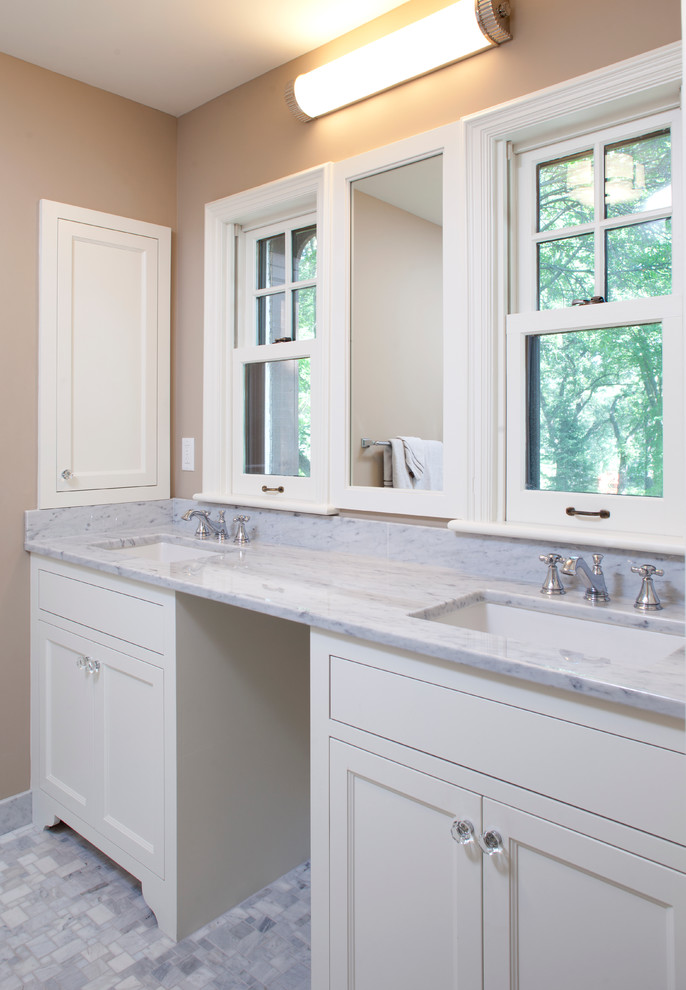 Small traditional ensuite bathroom in Minneapolis with a submerged sink, recessed-panel cabinets, white cabinets, marble worktops, an alcove shower, a two-piece toilet, grey tiles, mosaic tiles, beige walls and mosaic tile flooring.