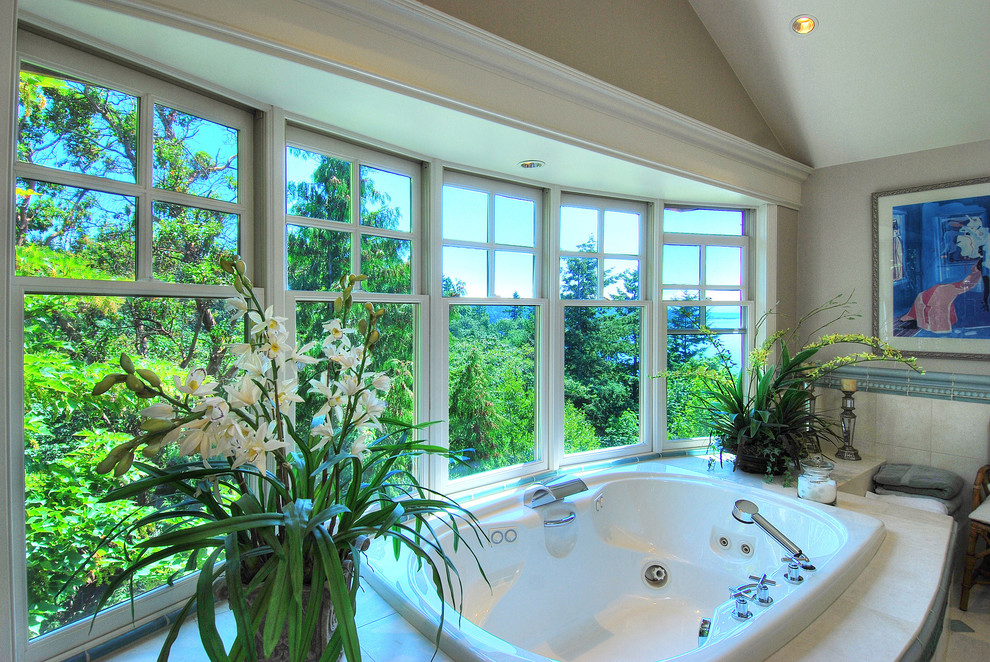 Inspiration for a large timeless master bathroom remodel in Seattle with a hot tub and gray walls