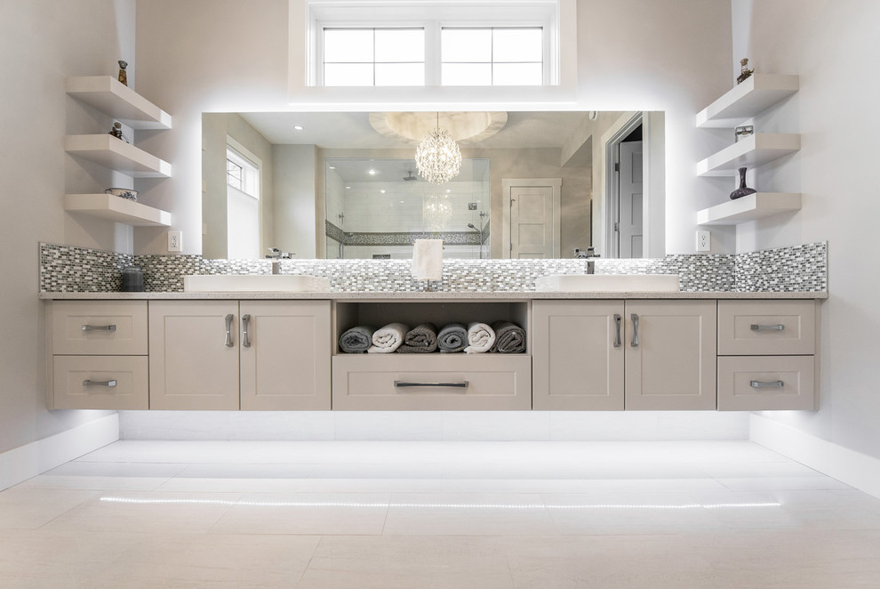 Photo of a contemporary bathroom in Edmonton with light wood cabinets and a freestanding bath.