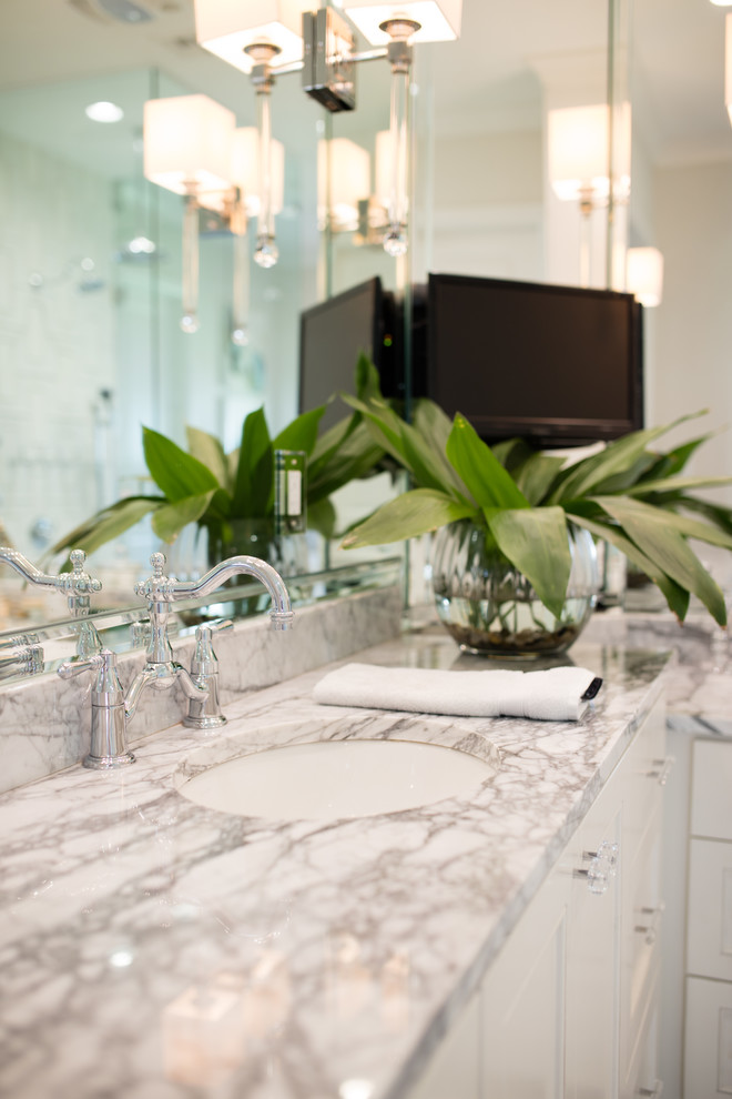 Inspiration for a huge transitional master marble floor and white floor alcove shower remodel in New Orleans with recessed-panel cabinets, white cabinets, beige walls, an undermount sink, granite countertops, a hinged shower door and gray countertops