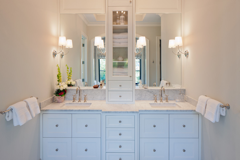 This is an example of a large classic ensuite bathroom in Grand Rapids with marble worktops, shaker cabinets, white cabinets, grey tiles, marble tiles, beige walls and a submerged sink.