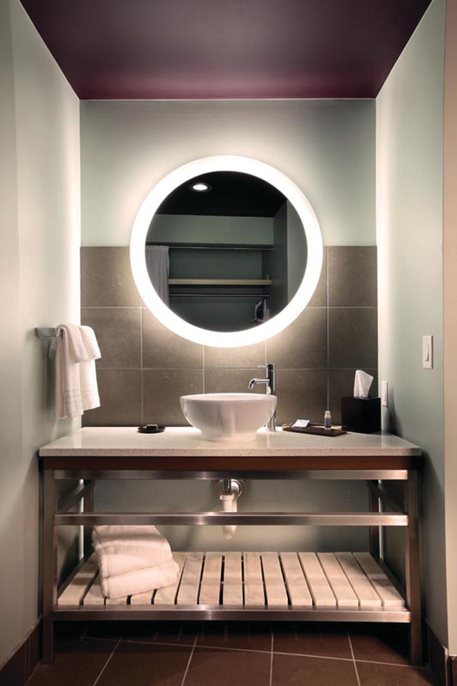 Photo of a world-inspired bathroom in Los Angeles with a vessel sink and grey walls.