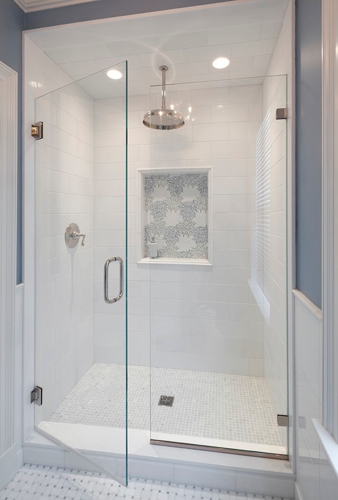 Alcove shower - large traditional kids' white tile and stone tile mosaic tile floor alcove shower idea in New York with an undermount sink, raised-panel cabinets, white cabinets, marble countertops and blue walls
