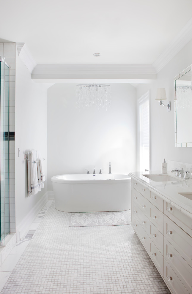 Mid-sized transitional white tile marble floor bathroom photo in Montreal with an undermount sink, recessed-panel cabinets, white cabinets, marble countertops and a one-piece toilet