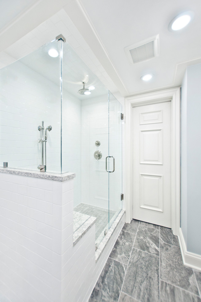 This is an example of a medium sized traditional ensuite bathroom in Nashville with flat-panel cabinets, white cabinets, a claw-foot bath, white tiles, metro tiles, blue walls, porcelain flooring, a submerged sink, engineered stone worktops, grey floors, a hinged door, an alcove shower and multi-coloured worktops.