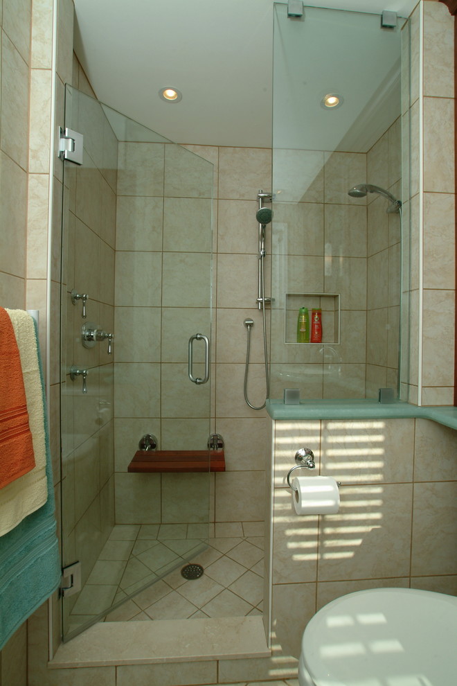 Small elegant master beige tile and ceramic tile ceramic tile double shower photo in Philadelphia with shaker cabinets, medium tone wood cabinets, an undermount tub, a one-piece toilet and beige walls