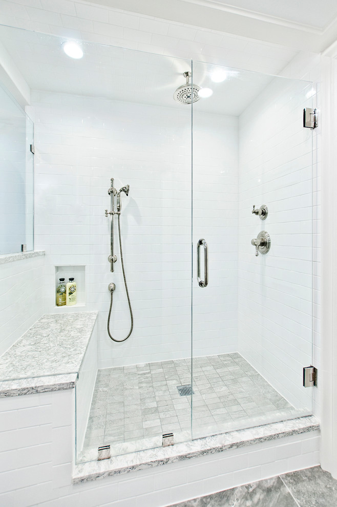 This is an example of a large classic ensuite bathroom in Nashville with beaded cabinets, white cabinets, a claw-foot bath, a corner shower, a two-piece toilet, white tiles, metro tiles, blue walls, porcelain flooring, a submerged sink, engineered stone worktops, grey floors and a hinged door.