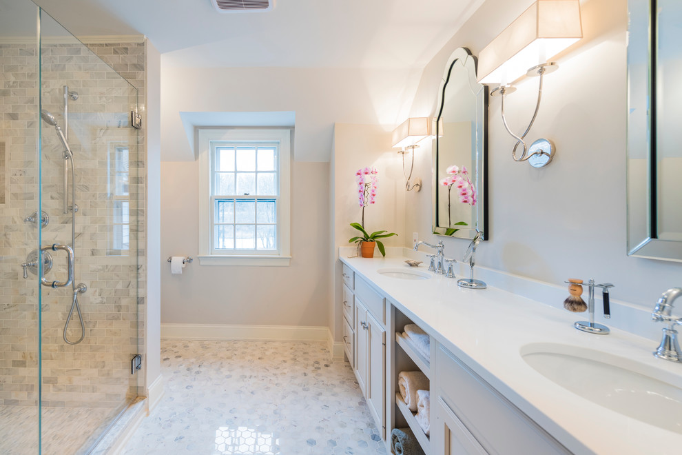 Doorless shower - large transitional master white tile and mosaic tile marble floor doorless shower idea in Philadelphia with recessed-panel cabinets, white cabinets, a one-piece toilet, beige walls, an undermount sink and quartz countertops