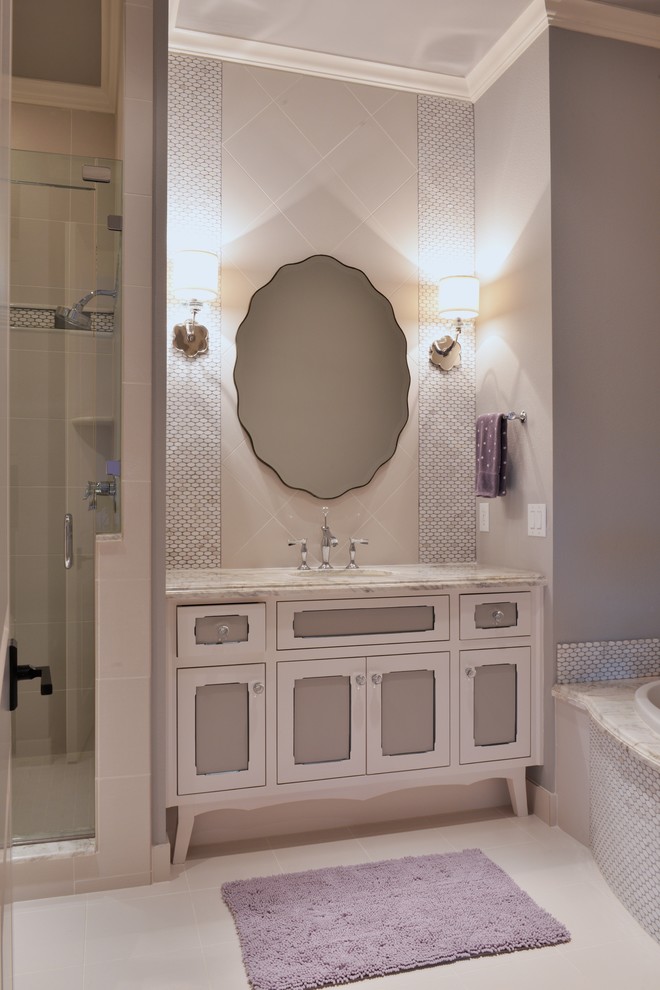Bathroom - mid-sized transitional kids' white tile and porcelain tile porcelain tile bathroom idea in Dallas with an undermount sink, furniture-like cabinets, white cabinets, marble countertops, a two-piece toilet and gray walls