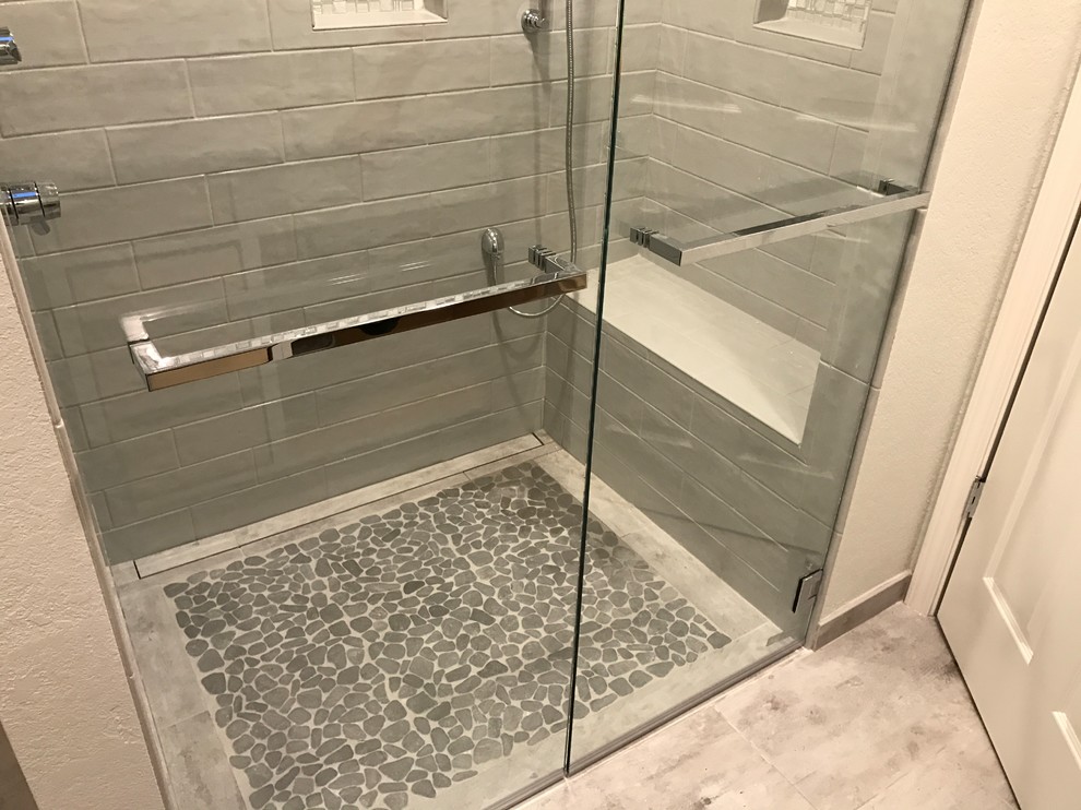Photo of a large traditional ensuite bathroom in Sacramento with grey tiles, ceramic tiles, grey walls and pebble tile flooring.