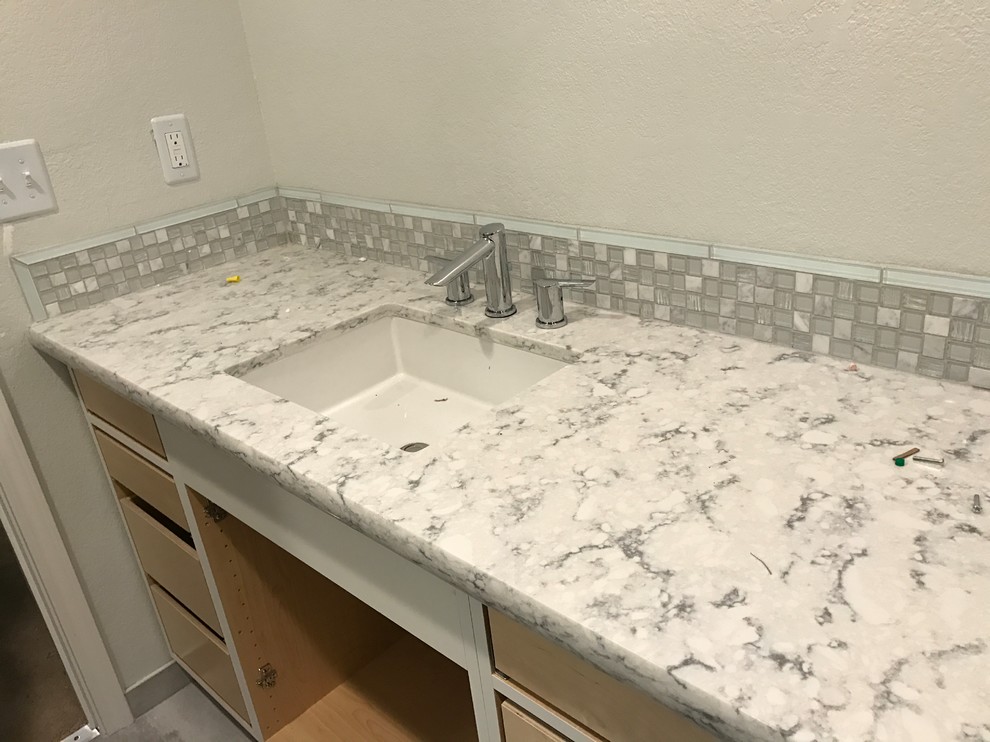 This is an example of a medium sized traditional ensuite bathroom in Sacramento with grey tiles, glass tiles, grey walls, porcelain flooring and engineered stone worktops.