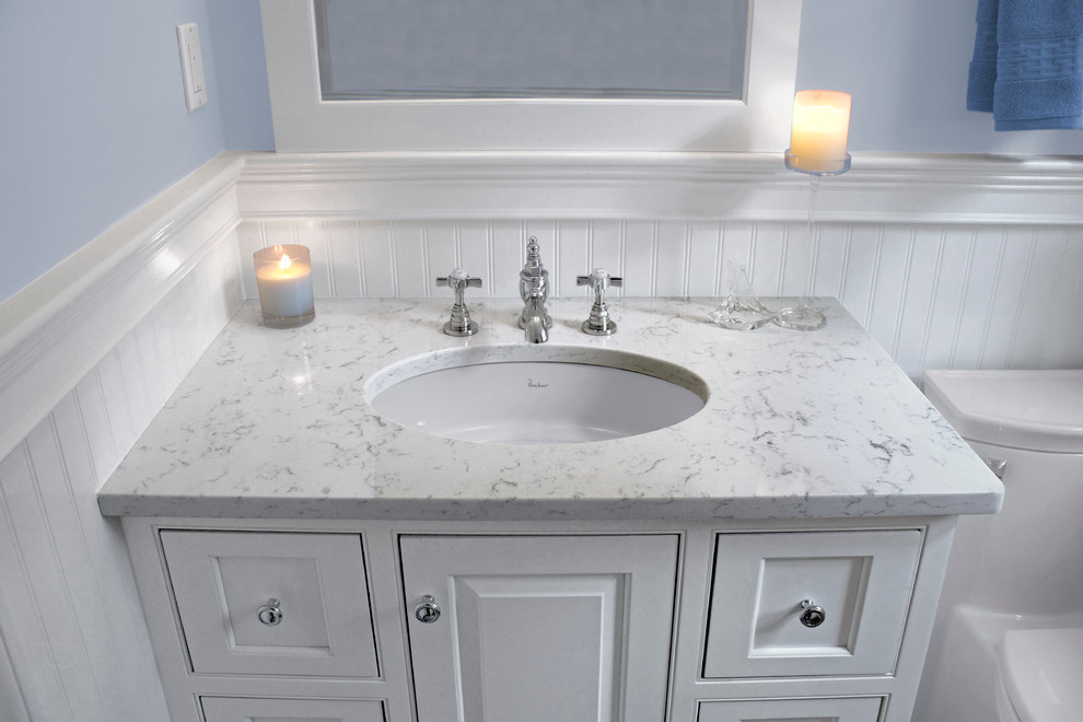 Inspiration for a small classic bathroom in Boston with a submerged sink, beaded cabinets, white cabinets, engineered stone worktops, a one-piece toilet, blue walls and porcelain flooring.