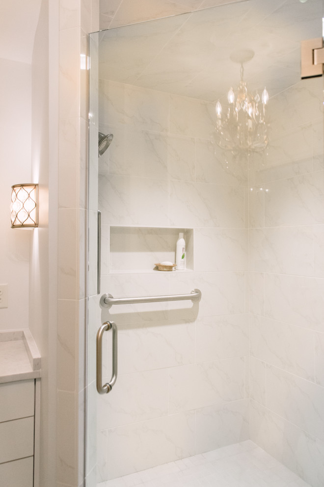Mid-sized elegant master white tile and porcelain tile porcelain tile corner shower photo in Birmingham with flat-panel cabinets, white cabinets, an undermount sink and quartz countertops