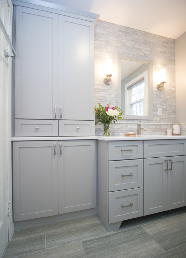 This is an example of a small classic ensuite bathroom in Boston with shaker cabinets, grey cabinets, a walk-in shower, a two-piece toilet, grey tiles, mosaic tiles, grey walls, ceramic flooring, a submerged sink and engineered stone worktops.