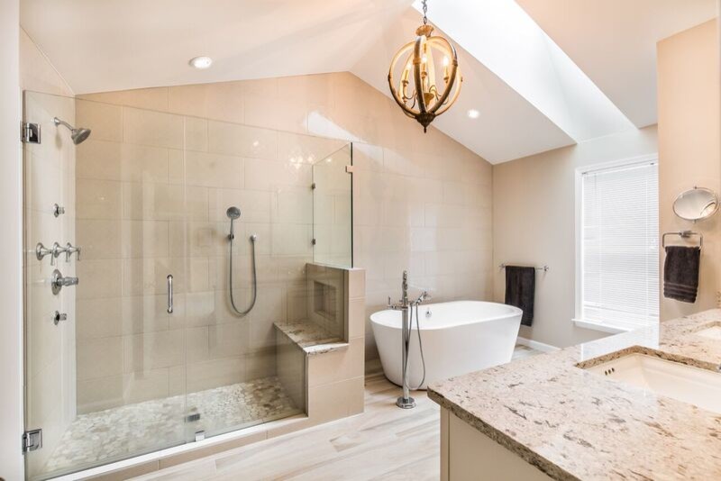 Inspiration for a large transitional master beige tile and porcelain tile porcelain tile bathroom remodel in DC Metro with furniture-like cabinets, white cabinets, a two-piece toilet, beige walls, an undermount sink and quartz countertops
