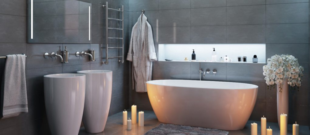 Imagen de cuarto de baño principal contemporáneo de tamaño medio con bañera exenta, baldosas y/o azulejos grises, baldosas y/o azulejos de porcelana, paredes grises, suelo de baldosas de porcelana, lavabo con pedestal y suelo gris