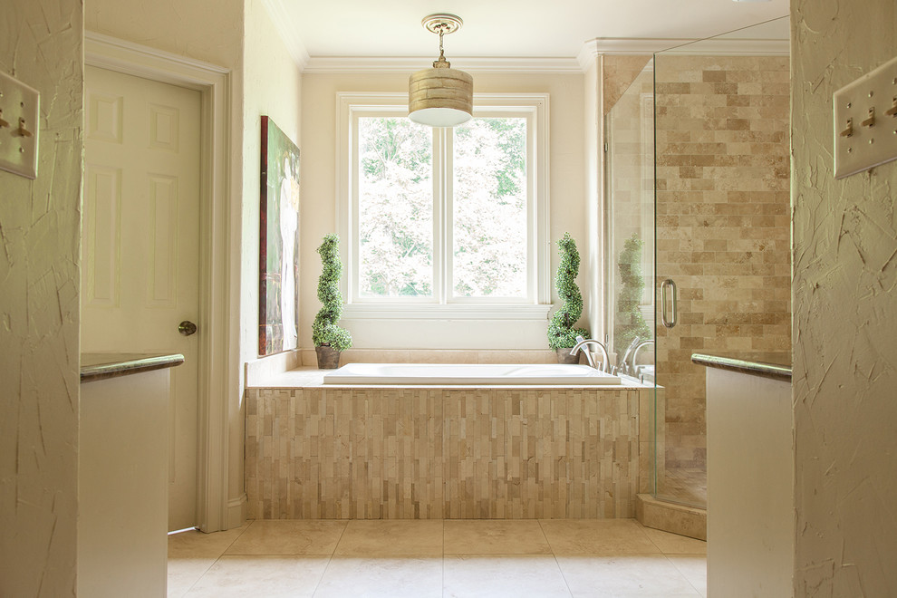 Photo of a medium sized contemporary ensuite bathroom in Birmingham with a built-in bath, a corner shower, ceramic tiles, beige walls, granite worktops, beige cabinets, a one-piece toilet, beige tiles, brown tiles and travertine flooring.