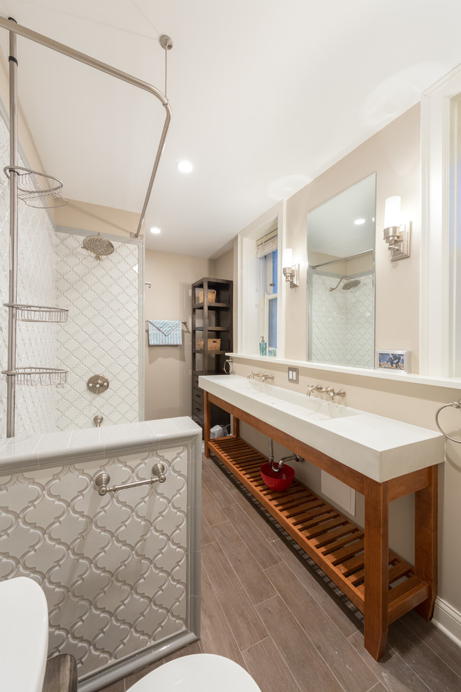 Design ideas for a medium sized classic ensuite bathroom in Chicago with an alcove bath, a shower/bath combination, a two-piece toilet, white tiles, terracotta tiles, painted wood flooring, a console sink, marble worktops and beige walls.