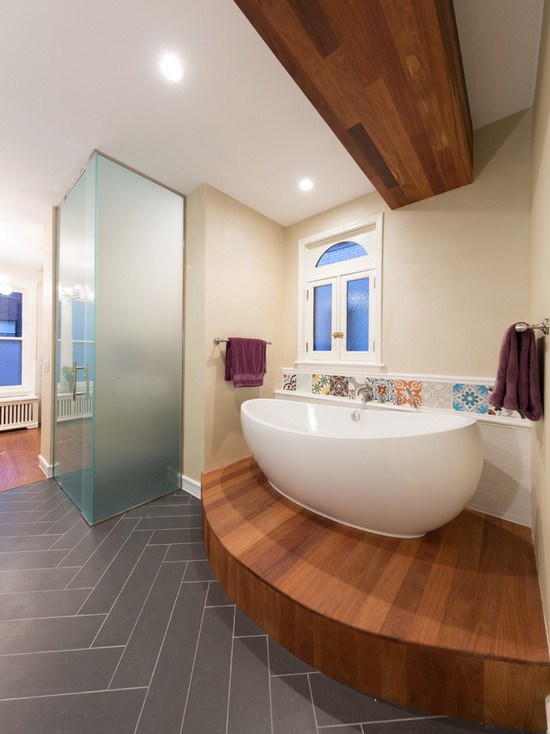 Large transitional master multicolored tile and ceramic tile ceramic tile bathroom photo in Chicago with flat-panel cabinets, dark wood cabinets, a two-piece toilet, beige walls, an undermount sink and solid surface countertops