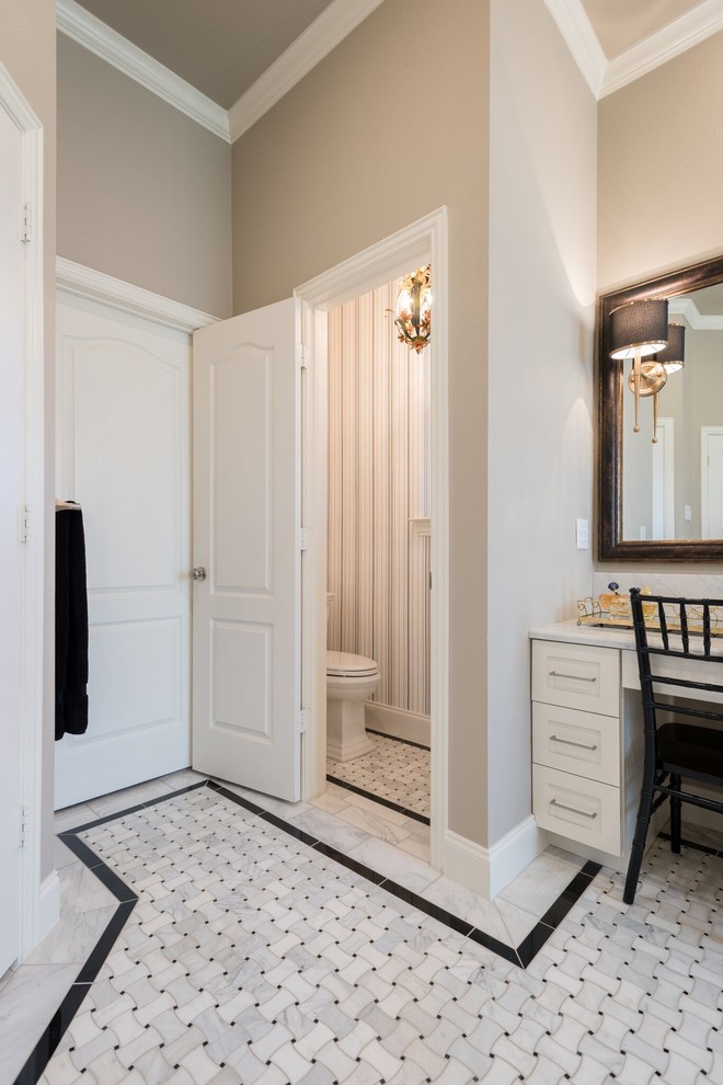 Inspiration for a large traditional ensuite bathroom in Dallas with white cabinets, a freestanding bath, a built-in shower, black and white tiles, mosaic tile flooring, a vessel sink, marble worktops, shaker cabinets, beige walls, white floors, an open shower, a one-piece toilet and porcelain tiles.