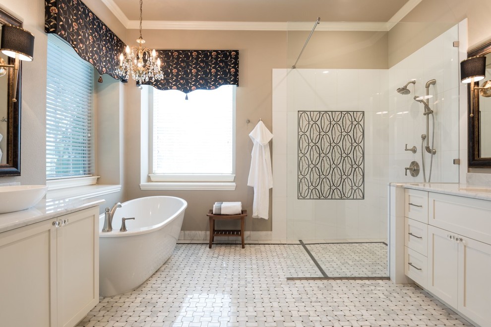 Photo of a large traditional ensuite bathroom in Dallas with white cabinets, a freestanding bath, a built-in shower, black and white tiles, mosaic tile flooring, a vessel sink, marble worktops, shaker cabinets, beige walls, white floors, an open shower, a one-piece toilet and porcelain tiles.