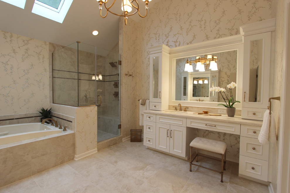 Bathroom - large traditional master beige tile and porcelain tile porcelain tile bathroom idea in Cleveland with an undermount sink, raised-panel cabinets, white cabinets and beige walls