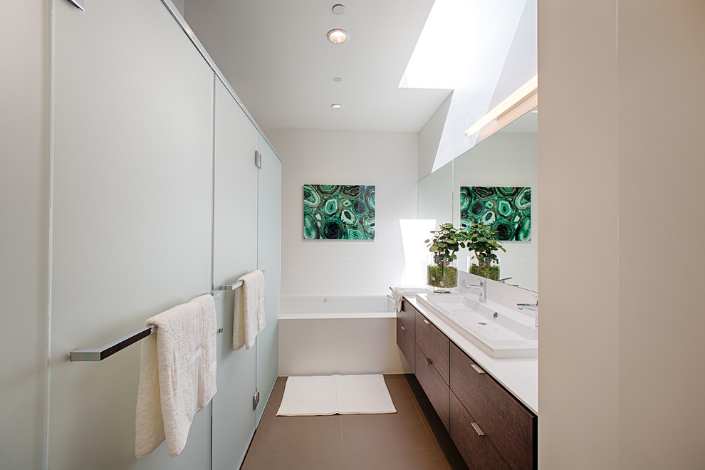 This is an example of a medium sized modern ensuite bathroom in Houston with a trough sink, flat-panel cabinets, medium wood cabinets, an alcove bath, white walls, quartz worktops, an alcove shower, brown floors and a hinged door.