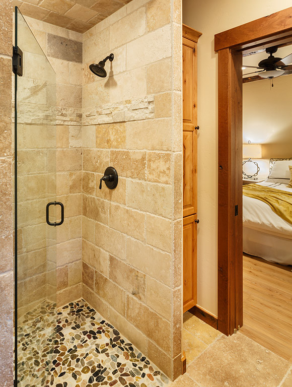 Mid-sized mountain style limestone floor bathroom photo in Albuquerque with beige walls
