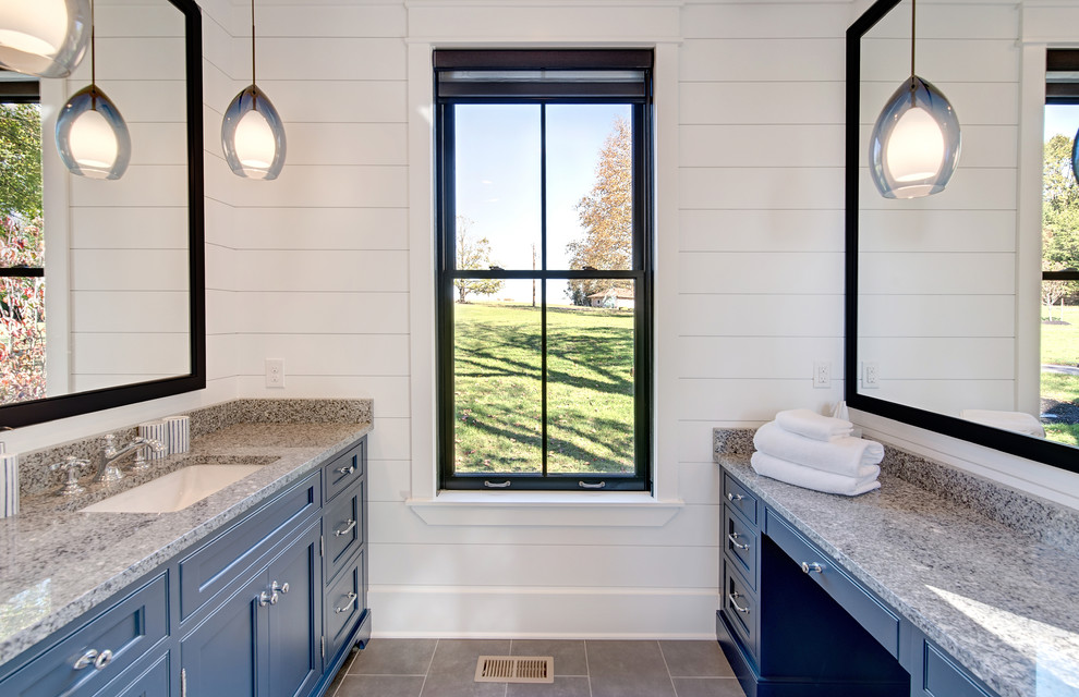 This is an example of a medium sized rural shower room bathroom in Baltimore with raised-panel cabinets, grey cabinets, an alcove shower, a two-piece toilet, grey tiles, porcelain tiles, white walls, porcelain flooring, a submerged sink, granite worktops, grey floors and a hinged door.