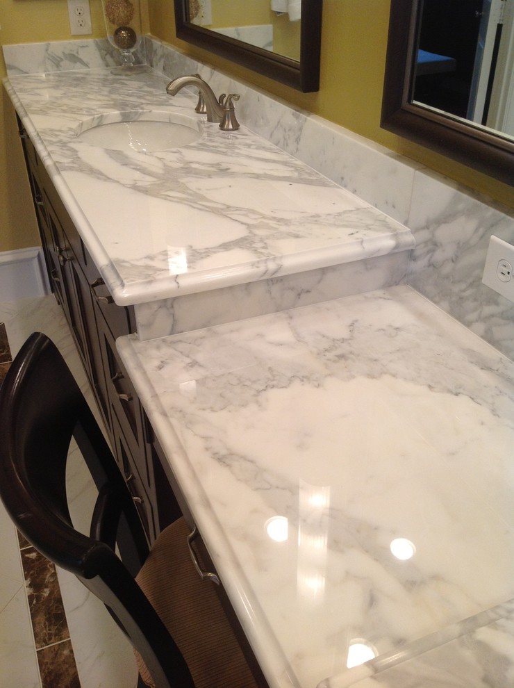 Inspiration for a timeless white tile and stone tile bathroom remodel in Dallas with an undermount sink, shaker cabinets, brown cabinets and marble countertops
