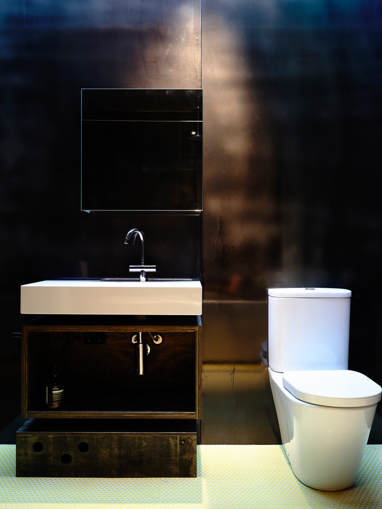 This is an example of a medium sized contemporary family bathroom in Melbourne with open cabinets, black cabinets, a freestanding bath, a walk-in shower, a wall mounted toilet, black tiles, metal tiles, black walls, a wall-mounted sink and wooden worktops.