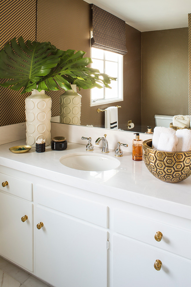 Inspiration for a transitional bathroom remodel in Los Angeles with flat-panel cabinets, white cabinets, multicolored walls and an undermount sink