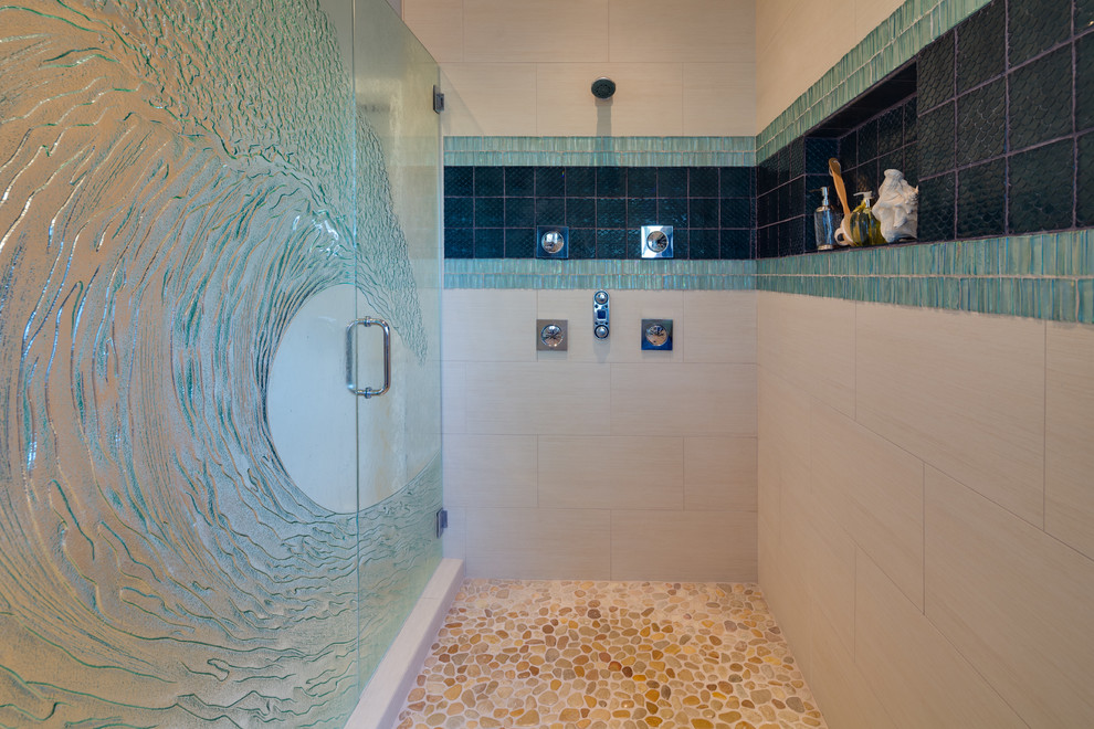 Example of a trendy multicolored tile pebble tile floor alcove shower design in San Diego