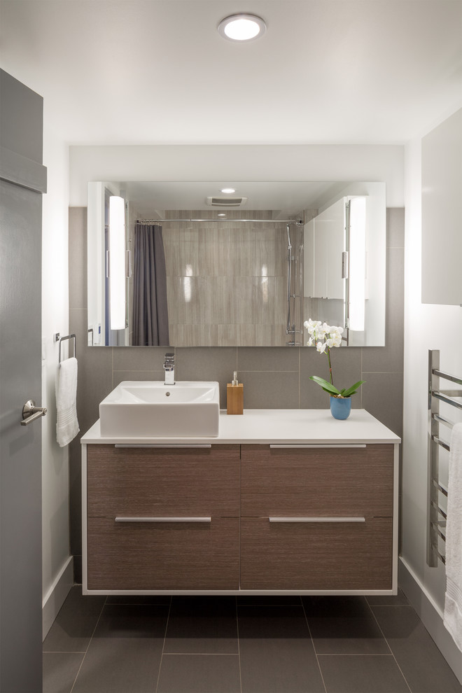 Design ideas for a contemporary bathroom in Vancouver with flat-panel cabinets, light wood cabinets and a vessel sink.