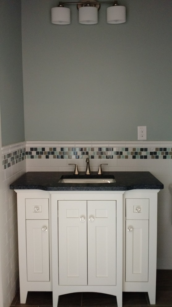 This is an example of a medium sized traditional shower room bathroom in Atlanta with shaker cabinets, white cabinets, a double shower, a one-piece toilet, white tiles, porcelain tiles, blue walls, porcelain flooring, a submerged sink and granite worktops.
