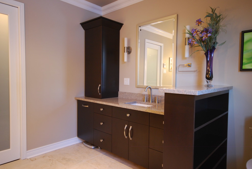 Design ideas for a contemporary ensuite bathroom in Ottawa with a submerged sink, flat-panel cabinets, dark wood cabinets, granite worktops, a built-in shower, beige tiles, porcelain tiles, beige walls and porcelain flooring.