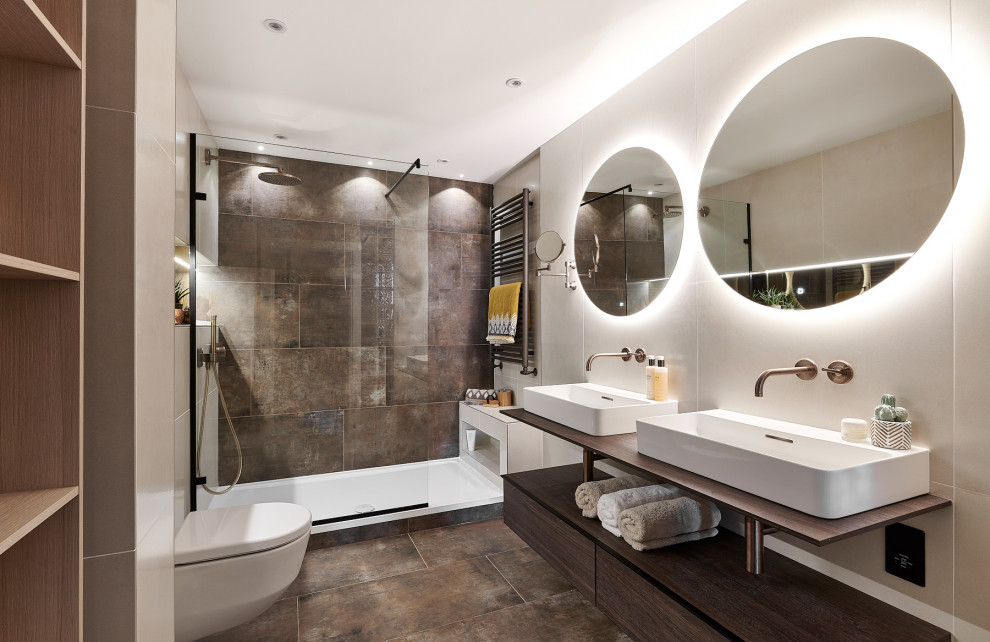 Bathroom - mid-sized contemporary master brown tile and porcelain tile porcelain tile, brown floor and double-sink bathroom idea in Cardiff with open cabinets, dark wood cabinets, a wall-mount toilet and beige walls