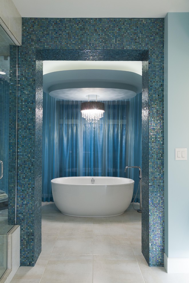 Inspiration for a contemporary blue tile and mosaic tile freestanding bathtub remodel in Other