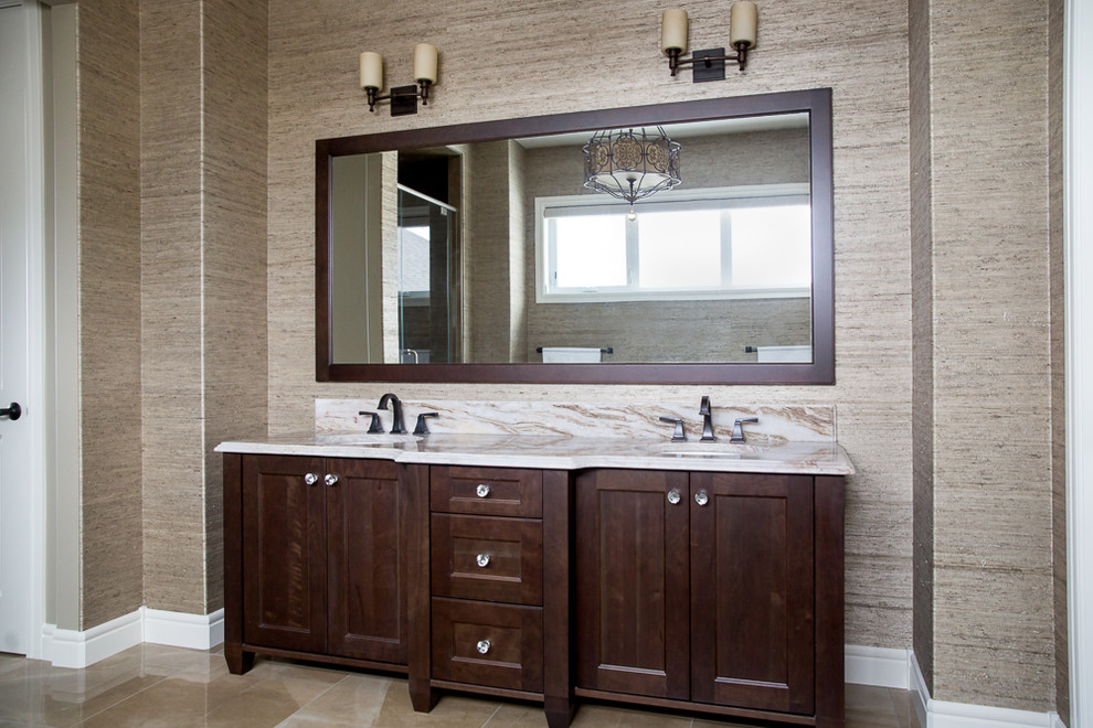 Large traditional ensuite bathroom in Vancouver with shaker cabinets, dark wood cabinets, a freestanding bath, an alcove shower, brown walls, a submerged sink, marble worktops, brown floors and a hinged door.
