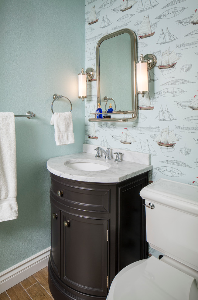 Inspiration for a medium sized coastal shower room bathroom in San Francisco with shaker cabinets, dark wood cabinets, a two-piece toilet, blue walls, dark hardwood flooring, a submerged sink and marble worktops.