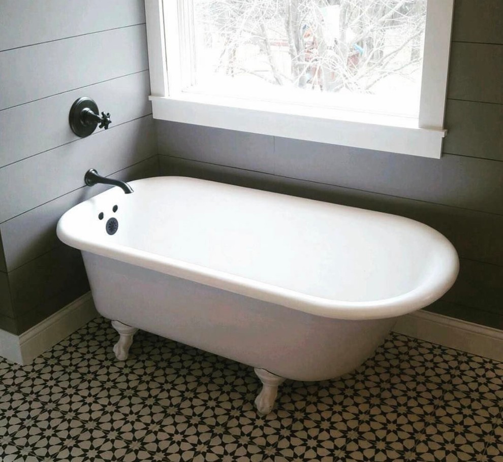 Medium sized rural bathroom in Dallas with a claw-foot bath, flat-panel cabinets, dark wood cabinets, white tiles, metro tiles, grey walls, cement flooring, a built-in sink and multi-coloured floors.