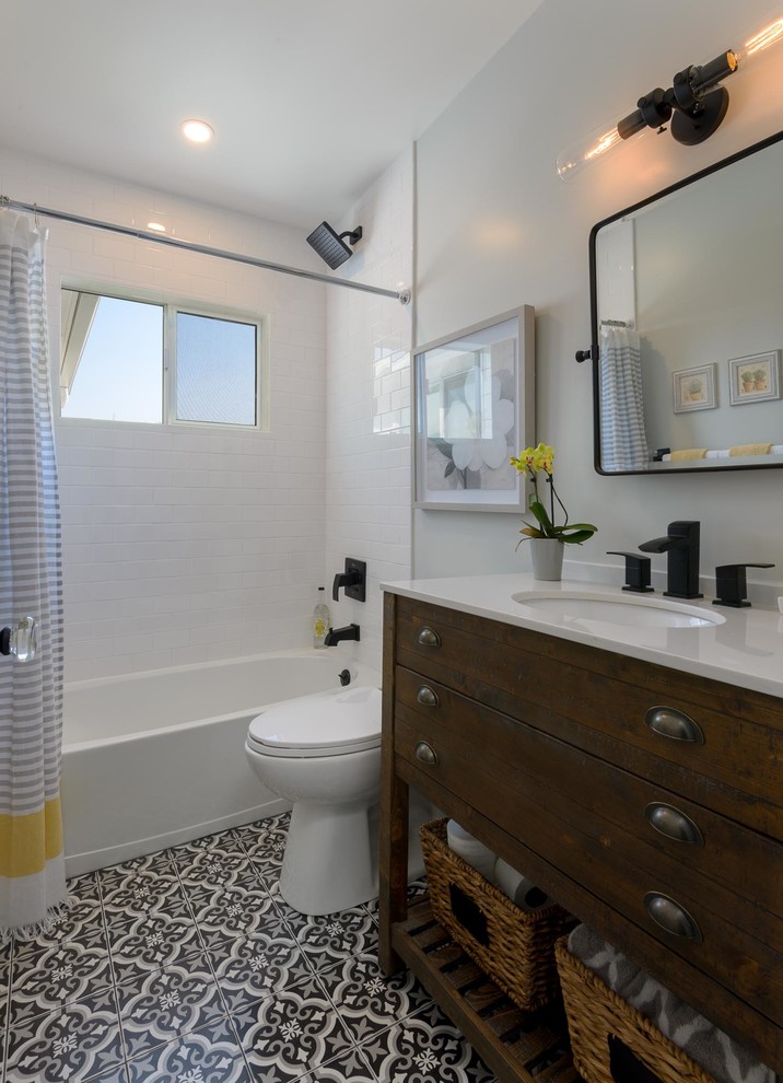 Inspiration for a small coastal ensuite bathroom in Santa Barbara with freestanding cabinets, distressed cabinets, a freestanding bath, a built-in shower, a two-piece toilet, white tiles, ceramic tiles, blue walls, marble flooring, a console sink, marble worktops, white floors, an open shower and white worktops.
