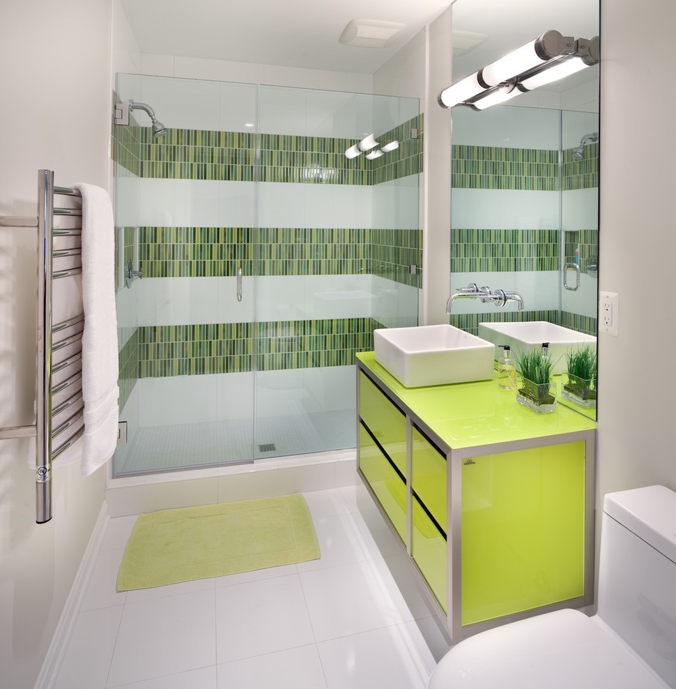 Contemporary bathroom in DC Metro with a vessel sink and green cabinets.