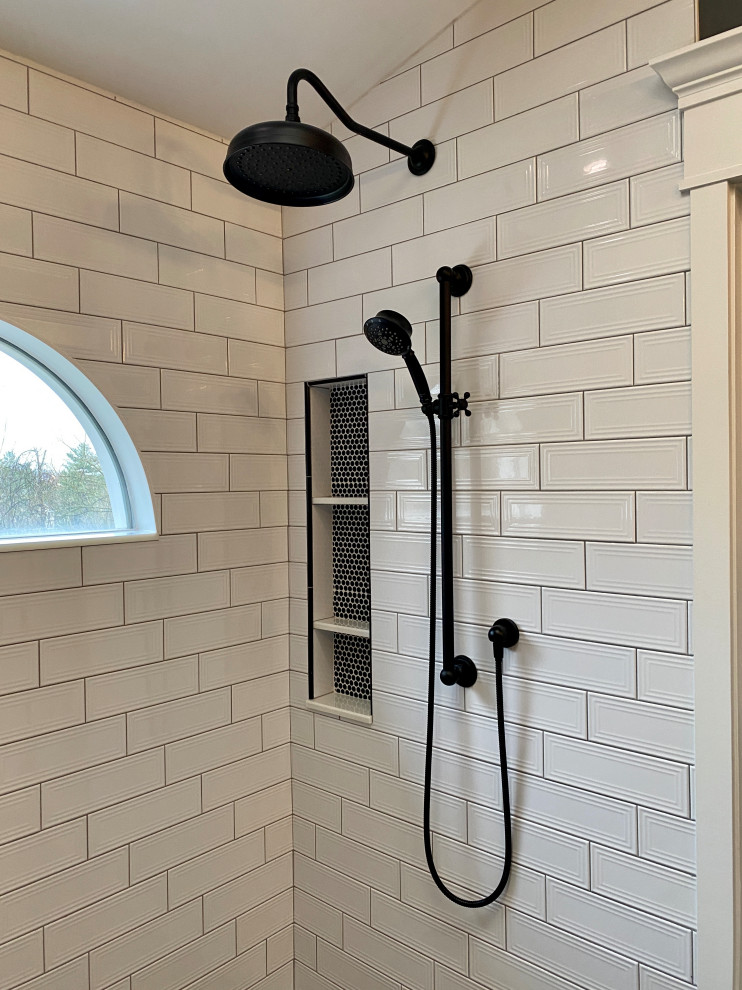 Master white tile and porcelain tile porcelain tile, brown floor, double-sink, vaulted ceiling and wainscoting bathroom photo in Cincinnati with white cabinets, a one-piece toilet, gray walls, an undermount sink, granite countertops, black countertops and a floating vanity