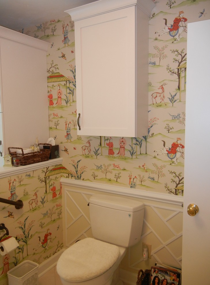 Inspiration for a mid-sized ceramic tile powder room remodel in Other with recessed-panel cabinets, white cabinets, a one-piece toilet and multicolored walls